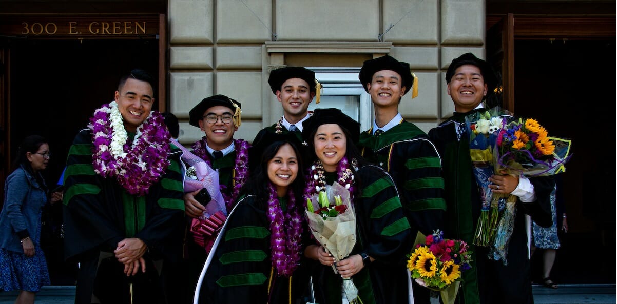 A group of graduates posing for a photo.