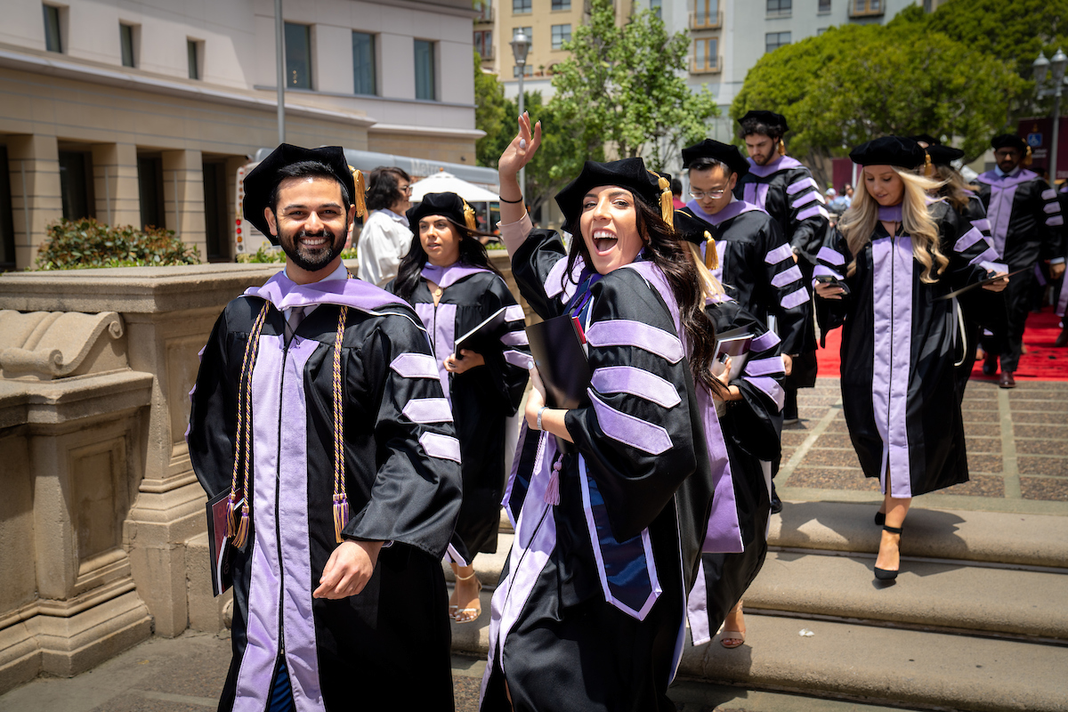 A group of people in graduation gowns and robes.