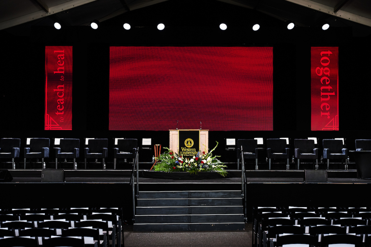 A large stage with a large screen behind it.