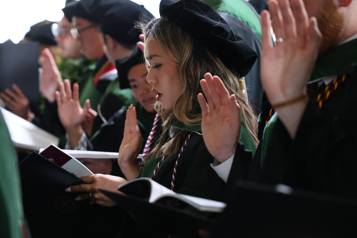 A group of people in graduation robes.