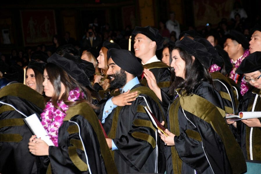 A group of people in graduation gowns and hats.