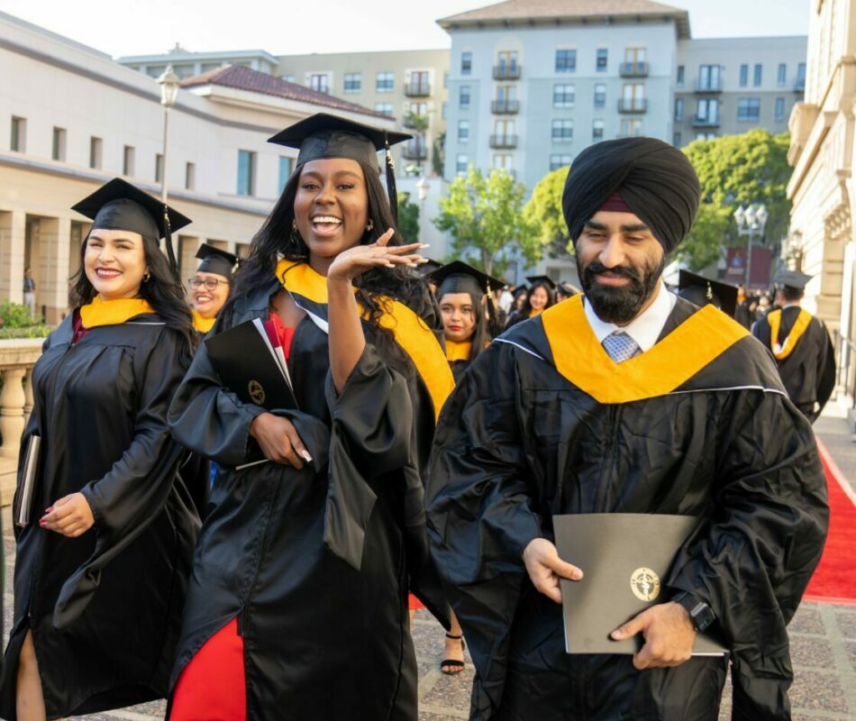 A group of people in graduation gowns and caps.
