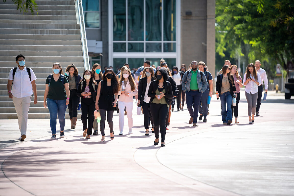 Sidewalk, group. CVM students walk the Esplanade