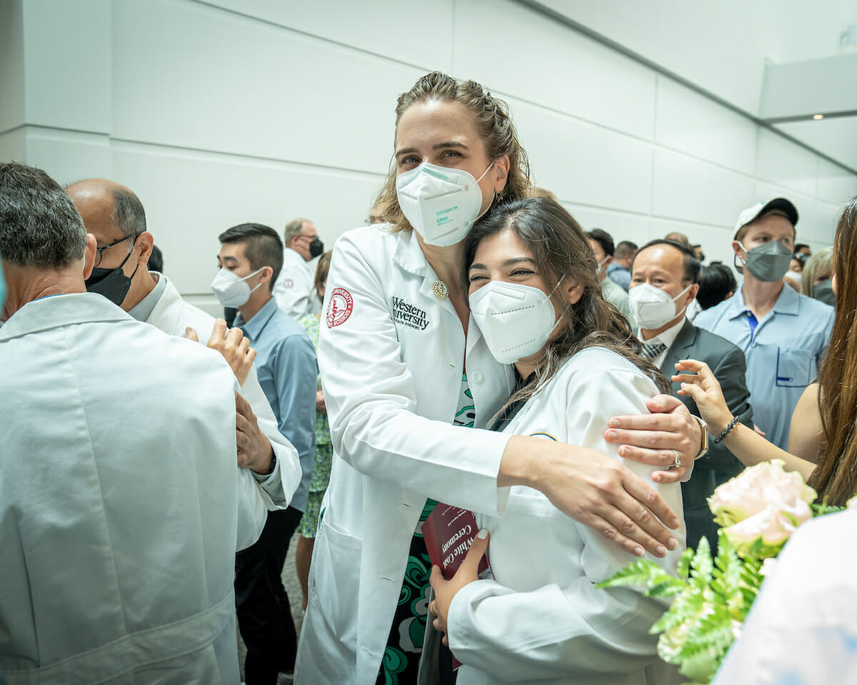 The College of Osteopathic Medicine of the Pacific held its White Coat Ceremony Saturday, Aug. 6, 2022 at the Ontario Convention Center. The White Coat Ceremony welcomes incoming students into the health care professions and helps them become aware of their responsibilities as healers. Student Martina Zaki shares a moment with Associate Dean of Student Affairs Dr. Michelle Emmert Park.