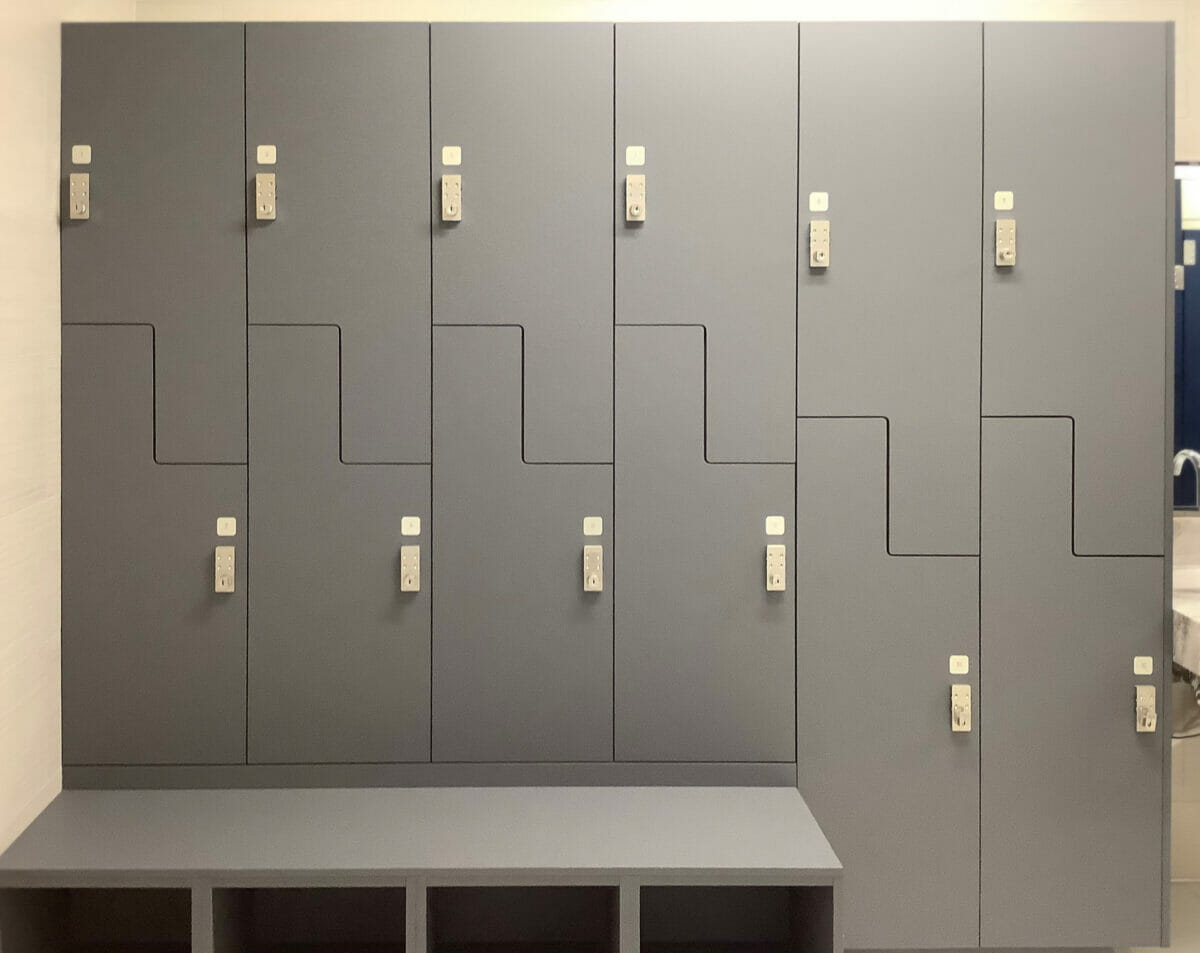 Grey lockers with a bench.