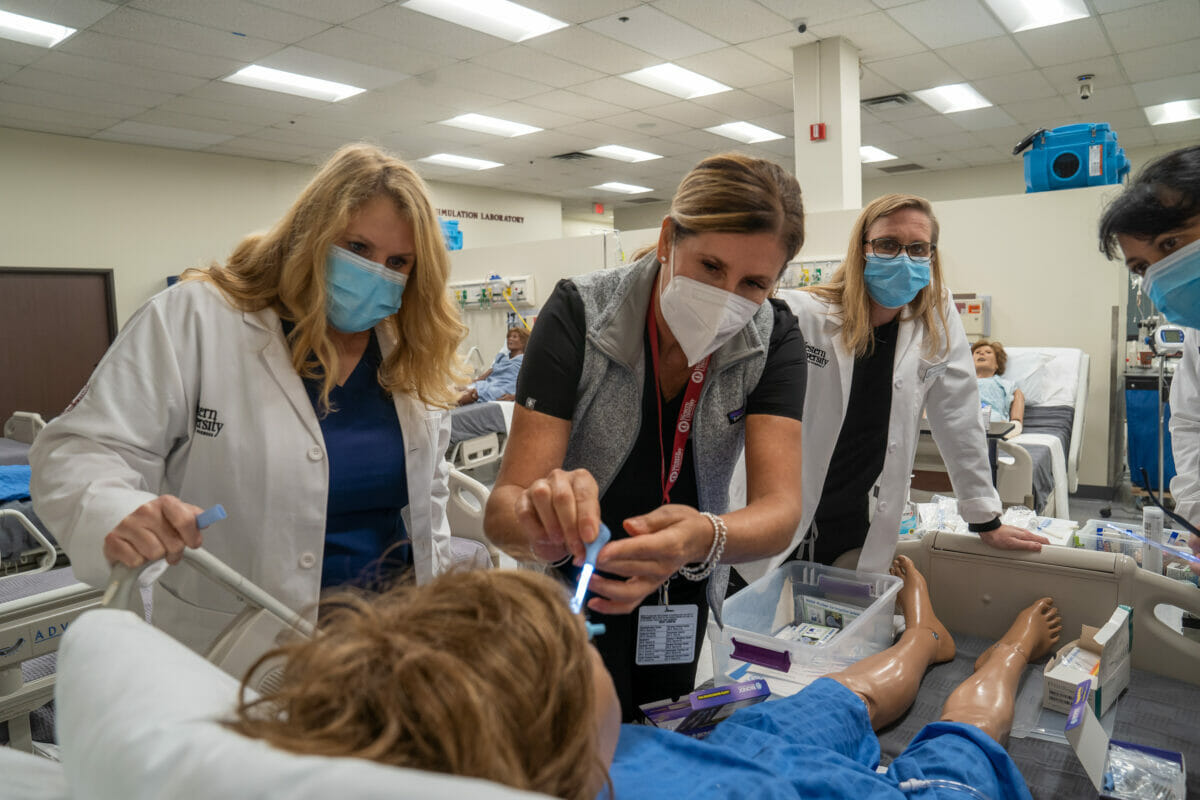 Emergency nurse students learning from faculty