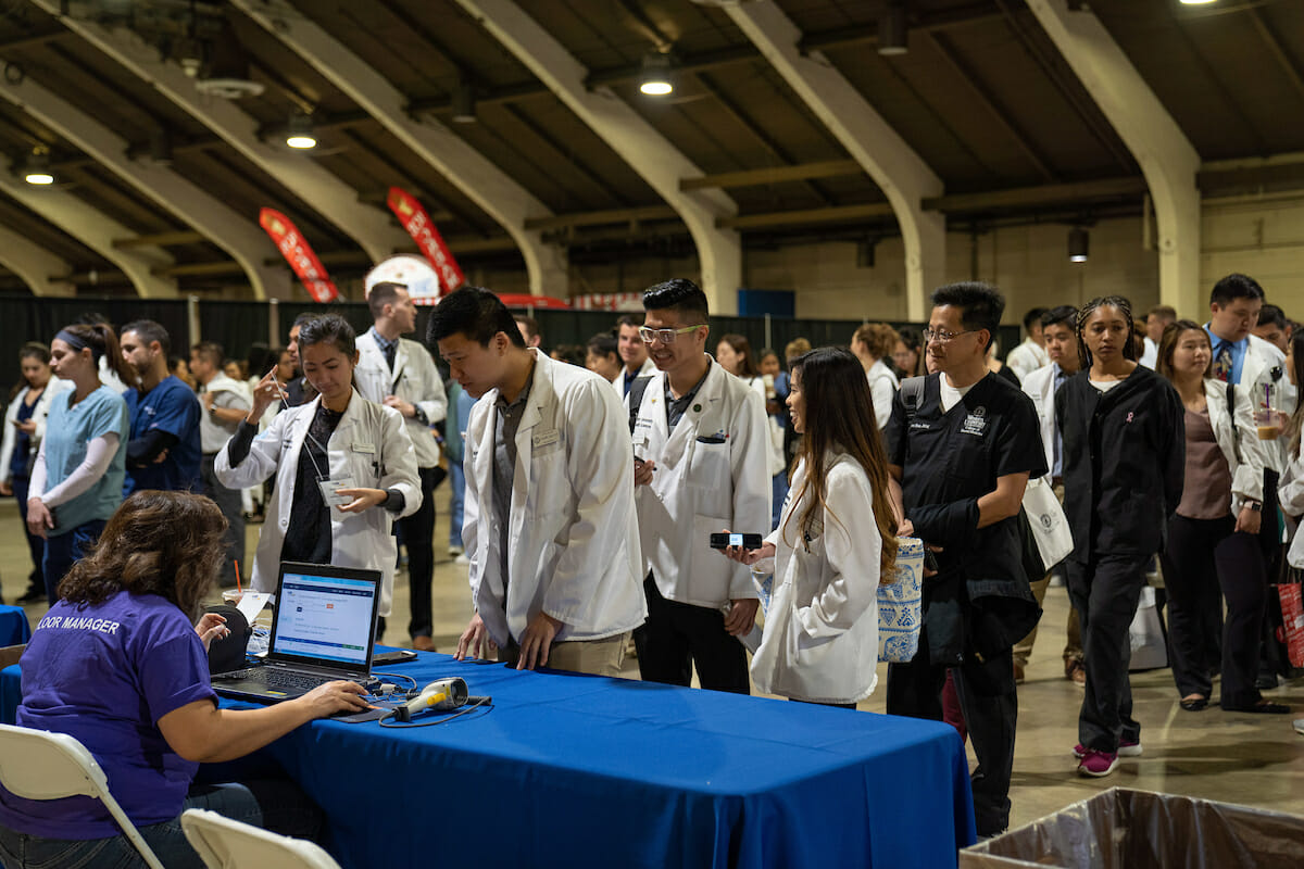 WesternU played a large role in Care Harbor Fairplex, a free mega-clinic April 27-28, 2019 in Pomona. Students check in at Care Harbor Fairplex.