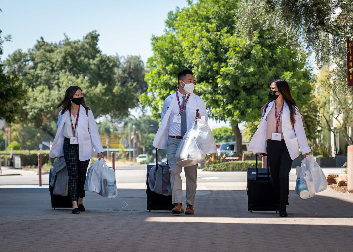 College of Optometry incoming students walk the Esplanade during WesternU Welcome Week day