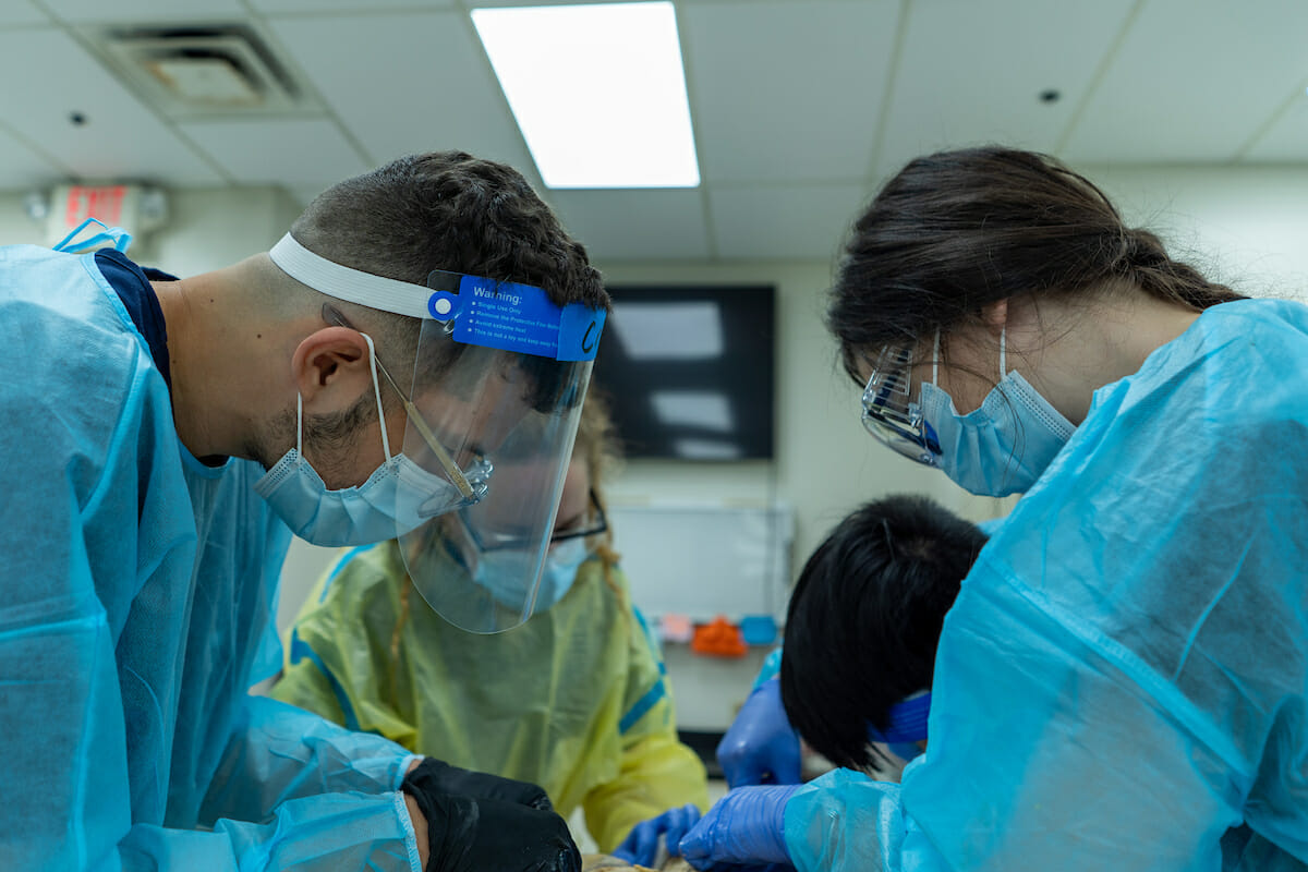 COMP students in ISAC inspect and disect the back of a donor in Gross Anatomy Lab Thursday, June 17, 2021.