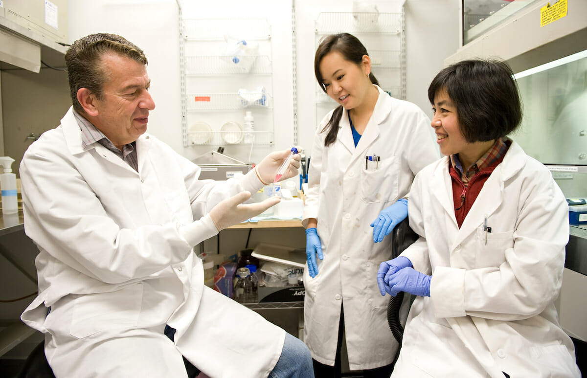 Dr. Michel Baudry and two students