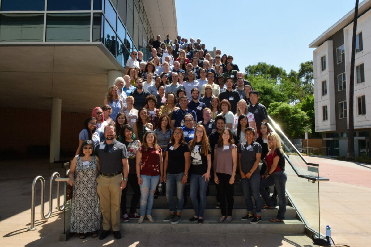 VetMed faculty and staff group photo taken outdoors on HEC staircase, Pomona campus