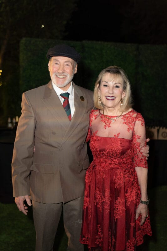 A man and woman standing next to each other .
