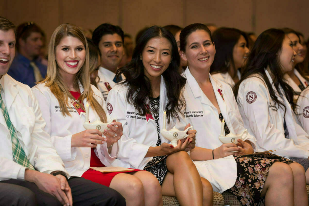 White coat ceremony , students are smiling