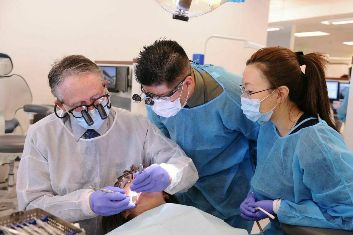 Dental students with a patient.